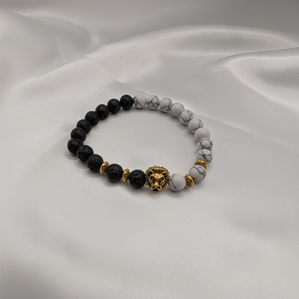 Elegant armband med lavasten, howlite och guldlejon